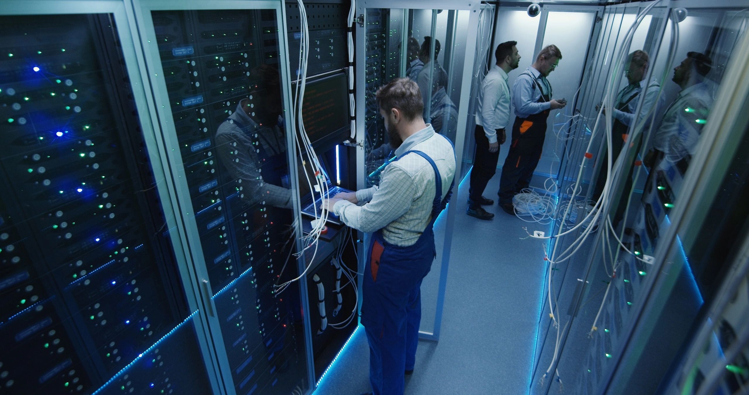 Security professionals working in a modern data center