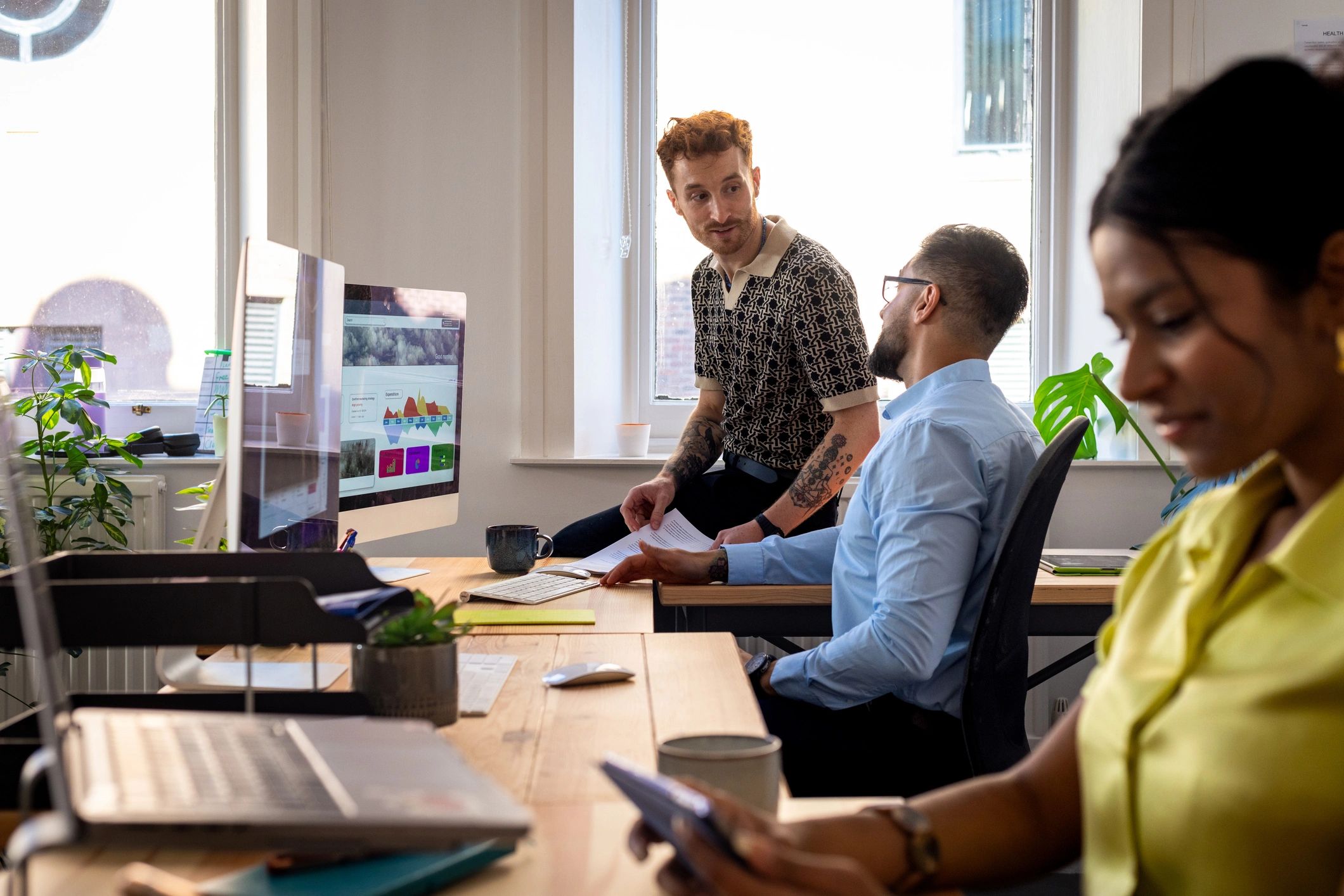 Security professionals collaborating in a modern office
